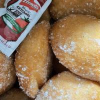 Yas Munchkins (10 Pc) · Fried dough-nuts dusted with cinnamon and powdered sugar.