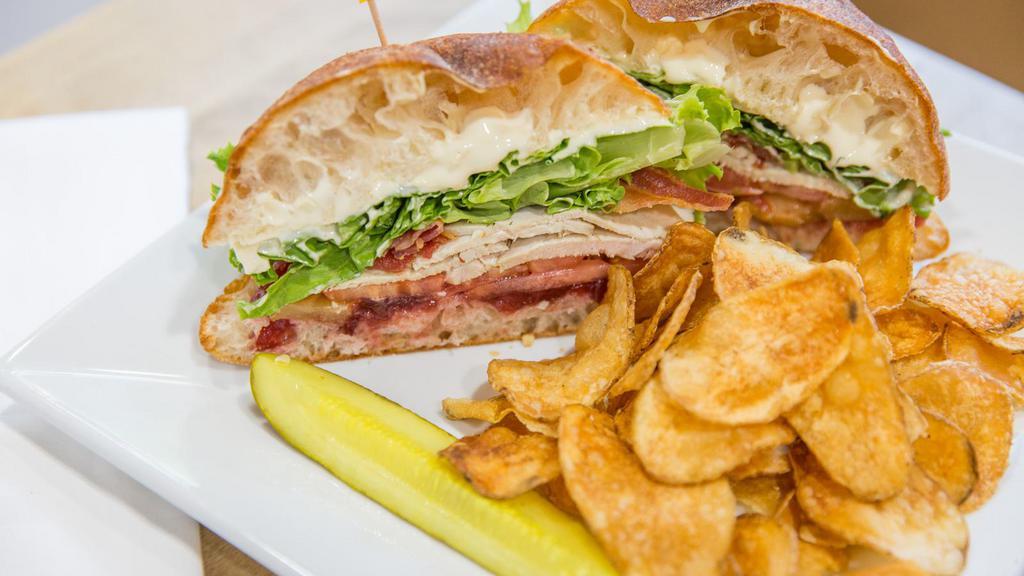 Old Orchard Beach · House roasted turkey, cranberry sauce, smoked bacon, grilled pears, brie cheese, lettuce and tomatoes on a ciabatta bread.