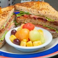 Applewood Bacon Turkey Club · Applewood bacon and roast turkey between three slices of homemade toast with mayo, lettuce a...