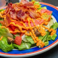 Blt Salad · Gluten-friendly. Chopped romaine, tomatoes and croutons tossed in homemade sun-dried tomato ...