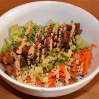 Spicy Tuna Poke Bowl · Steamed rice, cucumbers, shredded carrots, avocado, scallions, scallion soy, sriracha aioli,...