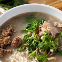 Special Beef Noodle Soup · 特制牛肉粉 A beef noodle soup with slices of rare steak, well done flank, tendon, meat ball, trip...