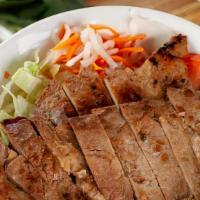 Lemongrass Pork Chops · 香茅猪排饭 Pan-seared boneless pork chop with steamed white rice. served with lettuce, carrot, cu...