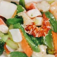 Seafood Delight · Lobster meat, shrimp, scallop, crab meat, a selection of vegetable mixed together.