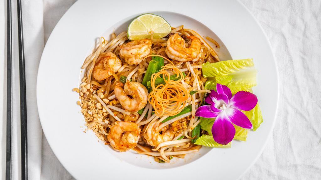 Pad Thai · Stir fried Thai noodle, egg, scallion, bean sprouts, dried bean curd and
fresh lime, sprinkled with ground peanut.