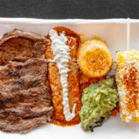 Carne Asada Tampiquena · Grilled tender steak marinated in our guajillo sauce and tequila with red cheese enchilada. ...