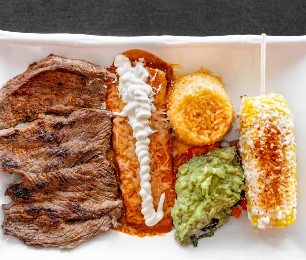 Carne Asada Tampiquena · Grilled tender steak marinated in our guajillo sauce and tequila with red cheese enchilada. Served with rice, guacamole, and a street corn on the cob.