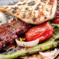Adana Kebab · Ground lamb, red peppers, herbs and spices served char-grilled on skewers. Served with rice.