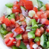 Shepherd Salad · Tomatoes, cucumbers, parsley, onions, green peppers, olive oil and red vinegar lemon juice.