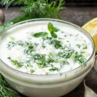 Cacik · Finely chopped baby cucumbers blended with garlic yogurt, mint, dill, and olive oil. Appetiz...