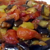 Patlican Soslu · Eggplant. Peppers with tomato sauce. Appetizers come with a side of pita bread.