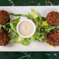 Falafel · Chickpeas, patties made of onions, celery, garlic, parsley, green pepper and herbs served wi...