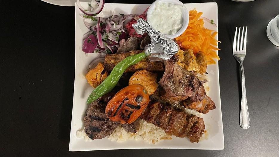 Mixed Grill  · Mixed grill combination chicken shish, lamb shish, chicken adana, lamb adana, lamb gyro. served with rice, grilled tomatoes and peppers