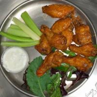 Boneless Buffalo Wings · Served with blue cheese and celery or ranch.