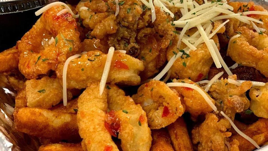 Calamari Basket · fried calamari topped with sweet chili sauce served with fries