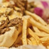 Steak Philly · Steak Philly with sweet peppers, cheese & Chef Skip's house sauce served on bun with a side ...