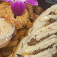 Steak Philly With Shrimp · served with sweet peppers, cheese & Chef Skip's house sauce served on a bun with a side of f...