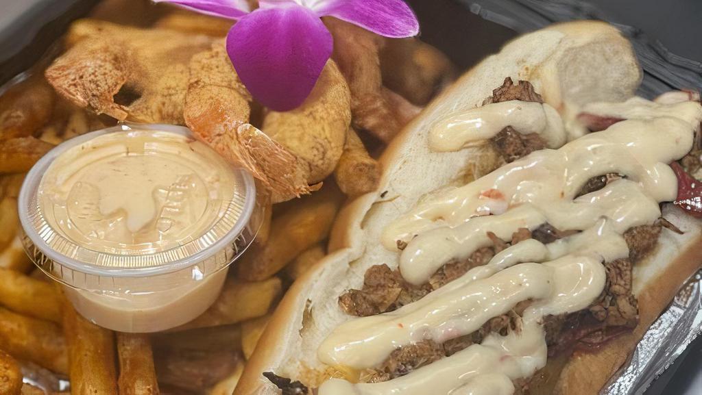 Steak Philly With Shrimp · served with sweet peppers, cheese & Chef Skip's house sauce served on a bun with a side of fries or over fries