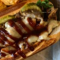 Bbq Chicken Sub · Shaved chicken with BBQ sauce, sautéed onions, cheddar cheese, and lettuce