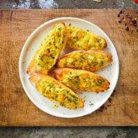 Cheesy Garlic Magic Bread · (Vegetarian) Housemade bread toasted and garnished with butter, garlic, mozzarella cheese, a...