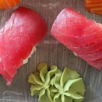 Maguro Nigiri* · tuna, 2 pieces, 
*Served raw or undercooked, or contains (or may contain) raw or undercooked...