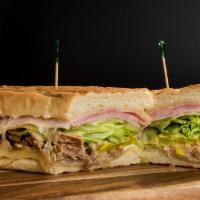 Real Cubano Panini Bundle · Roasted pork, cooked ham, Swiss cheese, butter, mustard, pickles, and tomatoes Served with y...