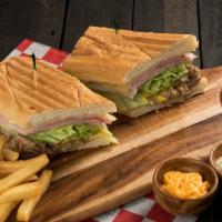 Real Cubano Panini · Roasted pork, cooked ham, Swiss cheese, butter, mustard, pickles, and tomatoes.