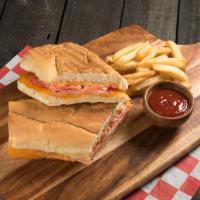 Dominican Panini · Cooked ham, butter, mayonnaise, ketchup, and green tomatoes.