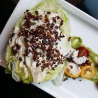 Wedge Salad · Iceberg, fourme d'ambert cheese, North country bacon, tiny tomato, shallots, blue cheese ran...