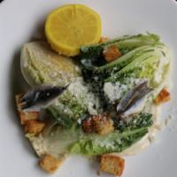 Caesar Salad · Petite romaine, white anchovy, and Parmesan crouton.