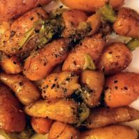 A5 Thumbelina Carrots · Carrots tossed in A5 beef drippings, finished with bourbon maple syrup and everything spice