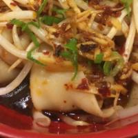 Szechuan Spicy Dumpling With Chili Oil & Peanuts 红脚手 · Hot and spicy.