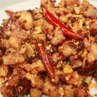 Sautéed Dry Diced Chicken With Chili & Pepper Szechuan Style  · Hot and spicy.