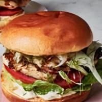 Grilled Chicken Sandwich · Grilled Chicken Breast on a soft sandwich roll with a side of creamy coleslaw and bag of chi...