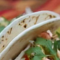Grilled Chicken Soft Tacos · Two soft tacos filled with grilled chicken, slaw, & drizzled with Yum Yum sauce.  Served wit...
