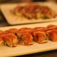 Spicy Tuna On Crispy Rice · Spicy tuna avocado on crispy rice drizzled with spicy mayo and eel sauce.