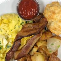 Cream Cheese & Chives Scrambled Eggs · Home fries, house-made biscuit, applewood smoked bacon.