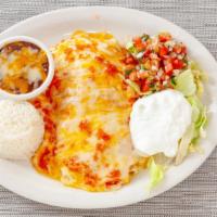 Burrito De Pollo · Filled with chicken and covered in cheese, served with salad, rice, and beans.