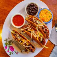 Combo · Recommended. Three tacos. Your choice of meat with rice and beans. Tacos are served with pic...