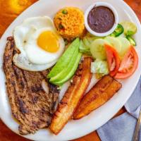 Montanero · Served with black beans, rice, fried pork, fried egg, plantains, salad, grilled steak, and f...