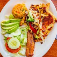 Pollo A La Plancha · Grilled chicken breast. Served with rice, saltáis vegetables, fried plantains, avocado, and ...