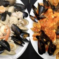 Fruitti De Mare · Shrimp, scallops, clams, mussels and haddock over linguine, choice of marinara, scampi or fr...