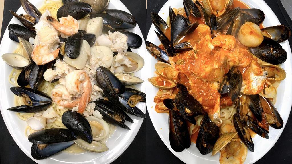 Fruitti De Mare · Shrimp, scallops, clams, mussels and haddock over linguine, choice of marinara, scampi or fra diavolo.