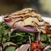 Arugula & Parmesan Salad · Tomato, shaved red onion, aged balsamic and extra virgin olive oil.