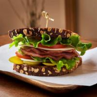 Smoked Ham Sandwich · Smoked ham, swiss cheese, pickled cucumber, tomatoes, lettuce and dijon mustard mayo on seve...