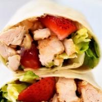 Strawberry Chicken Wrap · Fresh strawberry, grilled chicken, green spring mix, feta cheese, and ranch dressing on spin...