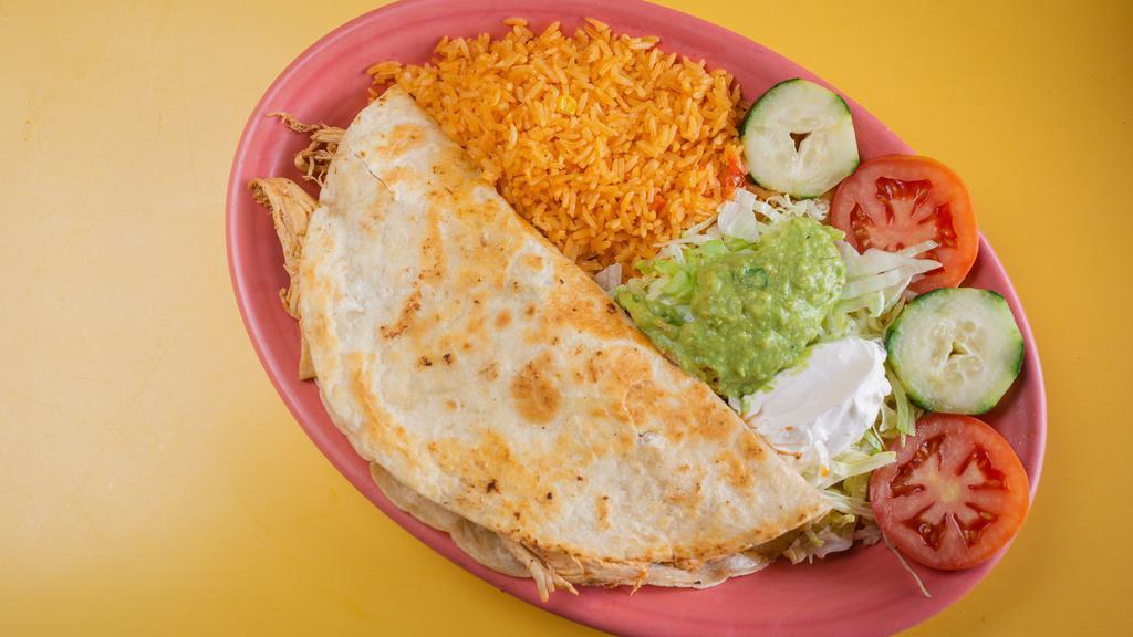 Jumbo Quesadilla · Large flour tortilla filled with beef tips, mushrooms and cheese, then grilled to perfection. Served with lettuce, guacamole, sour cream and Mexican rice.