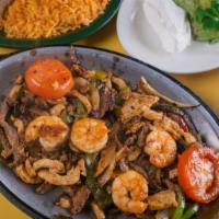 Texana Fajitas · Grilled chicken, steak and shrimp.