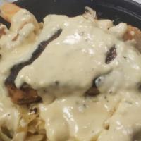 Salmon And Shrimp Alfredo · Grilled Salmon and Shrimp with fettuccine pasta served with homemade Alfredo Sauce, Spinach ...
