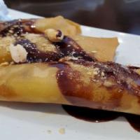 Fried Banana · Crispy banana rolls with chocolate whip cream.